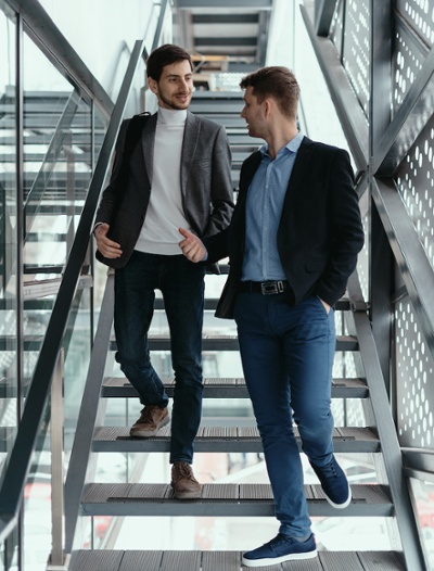 two-men-going-up-down-stairs-while-chatting-2